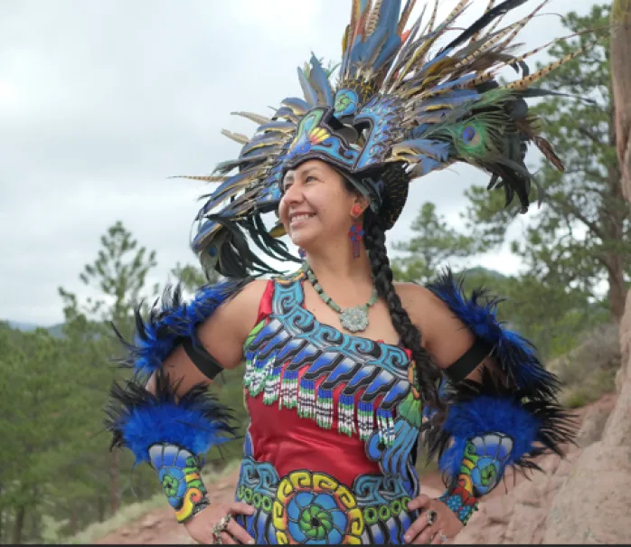 Photo of Andrea Nawage in her danza mexica regalia